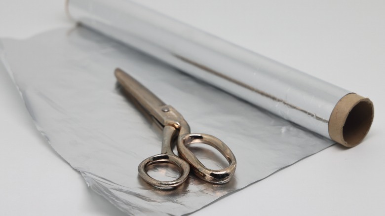 scissors and roll of aluminum foil