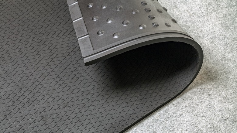 Black rubber mat on concrete