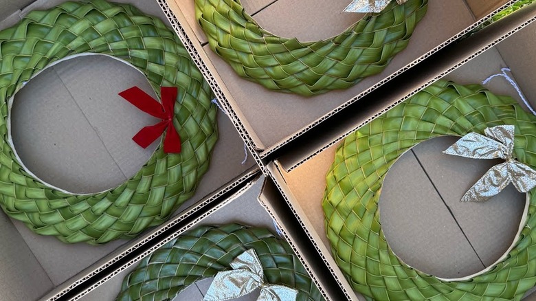 Woven palm frond door wreaths.