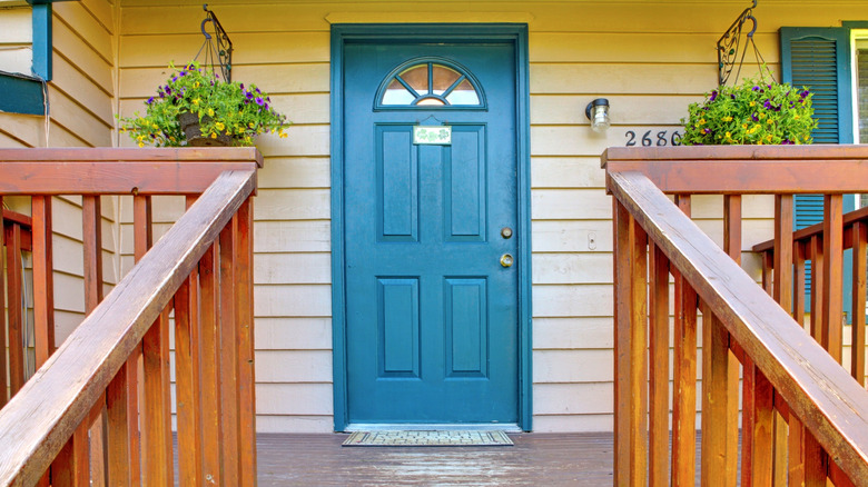 Bright blue trimming beige siding