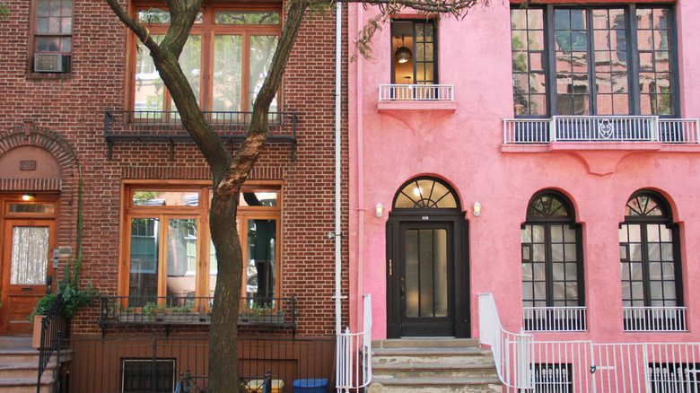 Pink townhouse and brick townhouse