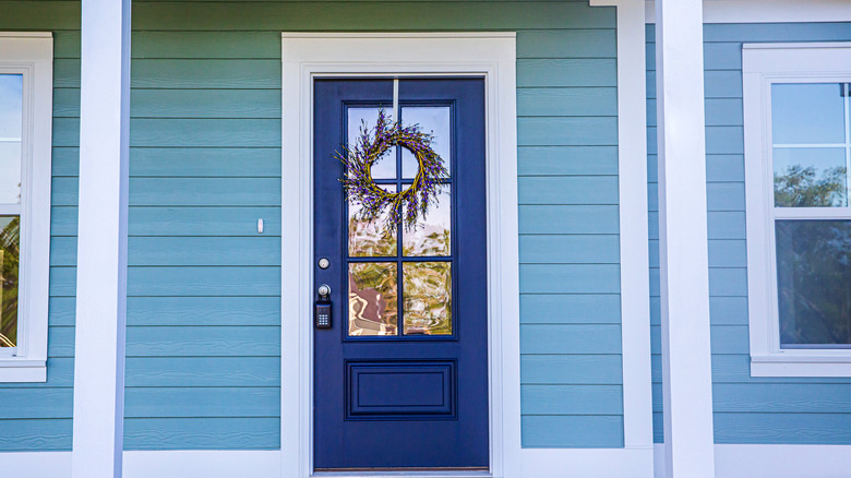 Blue siding dark blue door