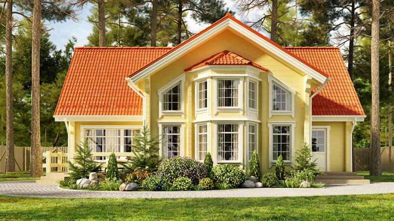 Yellow home exterior orange roof