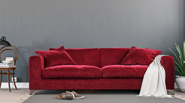 maroon couch in a room