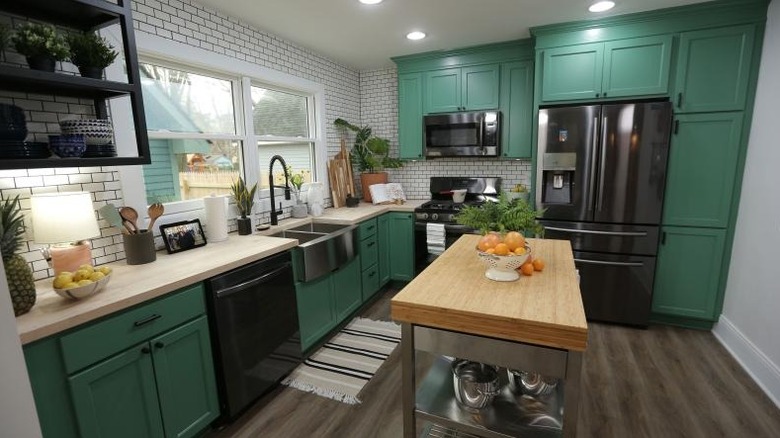 contemporary kitchen with green cabinets