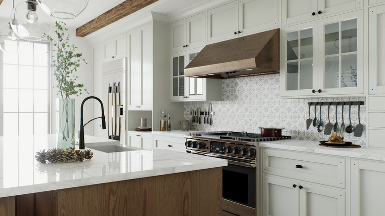 kitchen with cabinets to ceiling