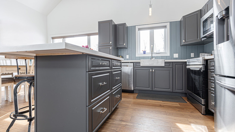 White countertops with dark gray cabinets