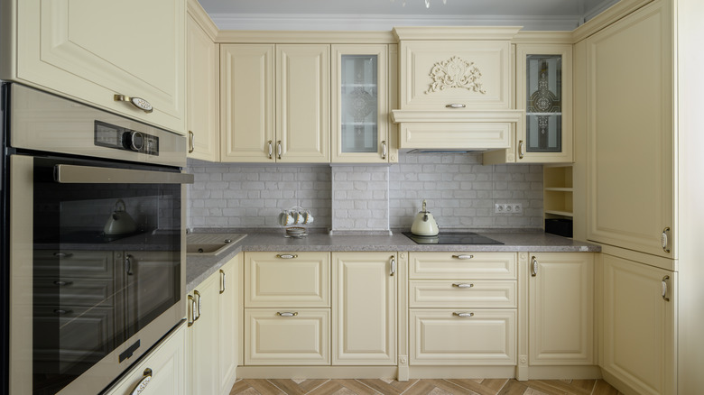 Rustic kitchen with cream cabinets