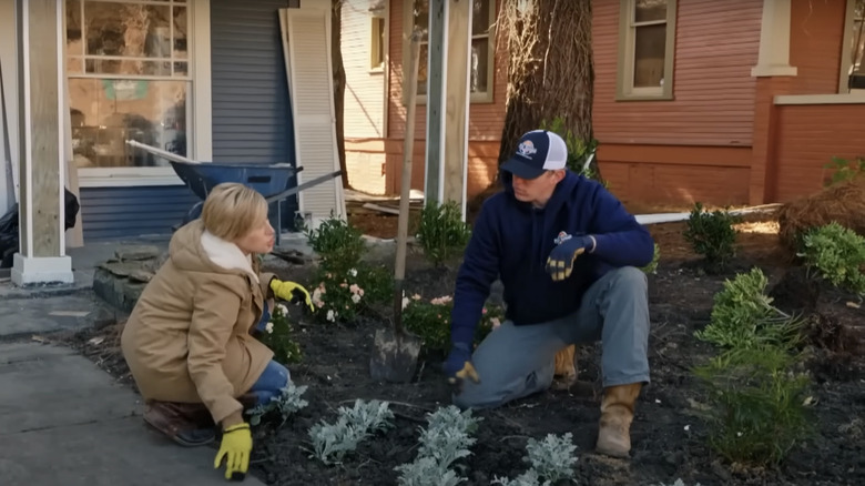 Erin Napier and man gardening 