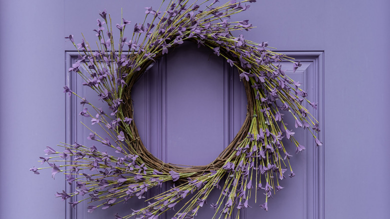 Purple door with a dried flower decoration