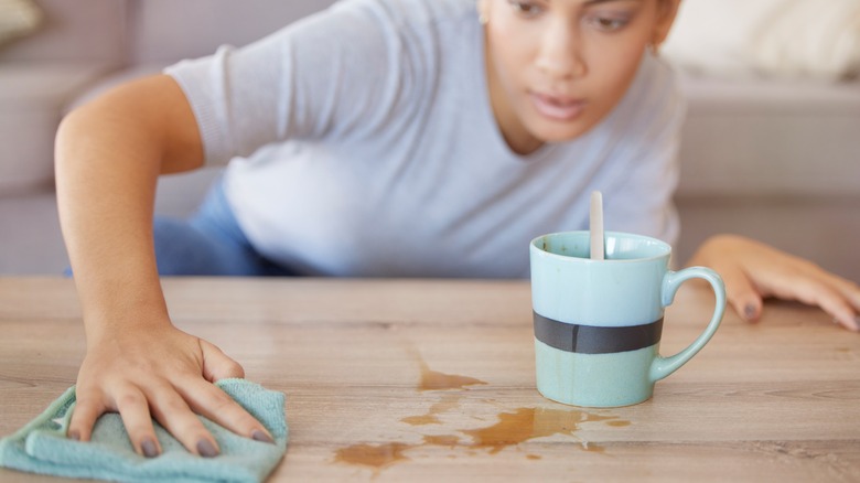 Woman cleaning countertop