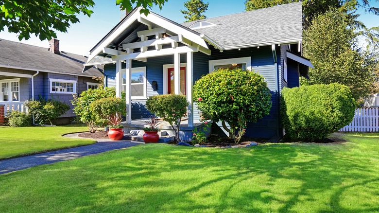 House with green front lawn