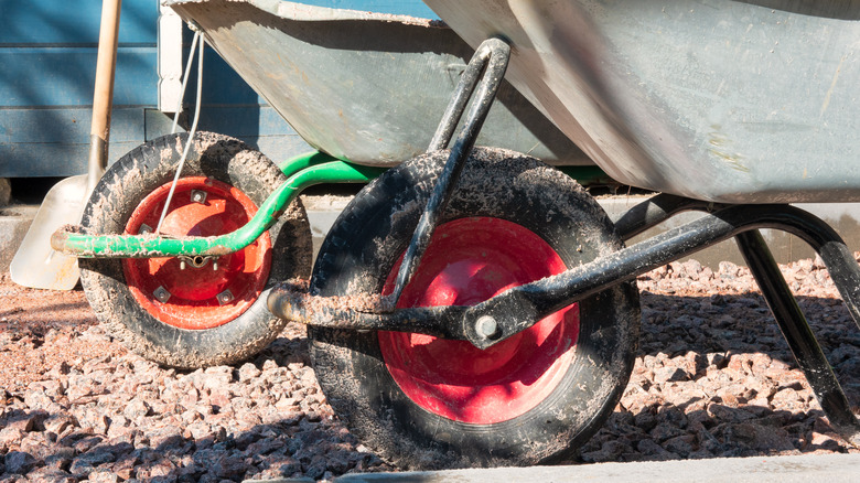 Two wheelbarrows on gravel driveway