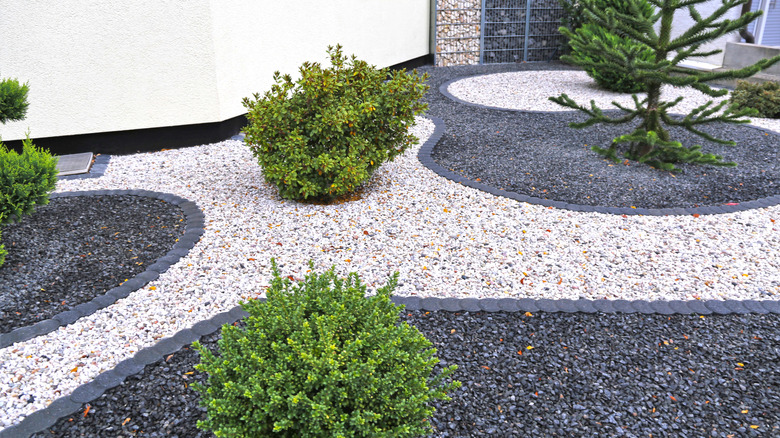 Two-toned gravel landscaping design in front yard