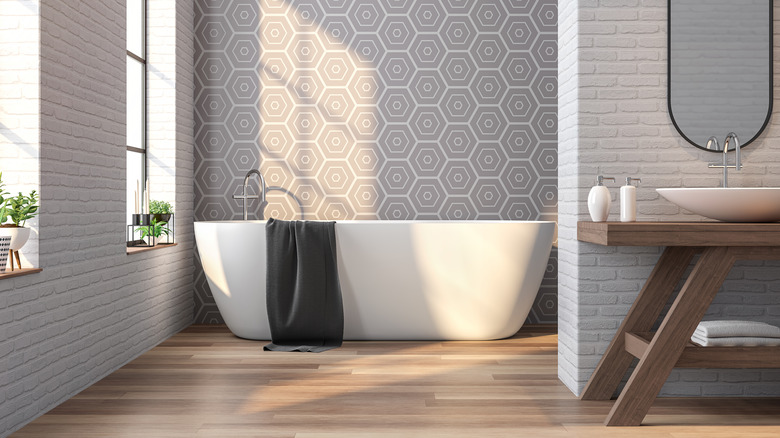 Patterned wallpaper in gray bathroom