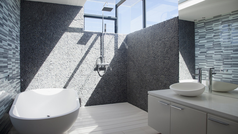 Gray bathroom with pebble tile