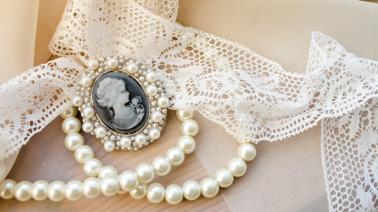 Antique pearls and cloth with locket