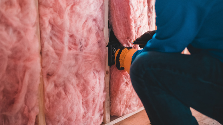 installing pink insulation in home