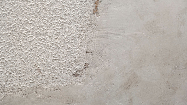 A popcorn ceiling has been partially removed