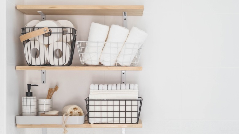 floating shelves in white bathroom