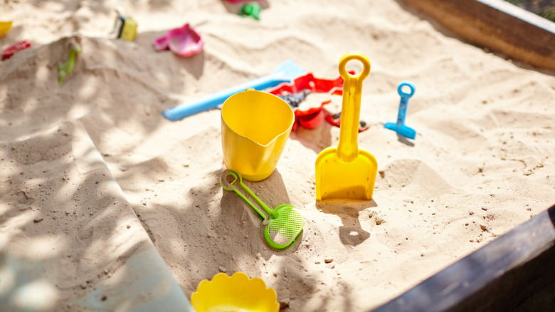 children's toys in sandbox