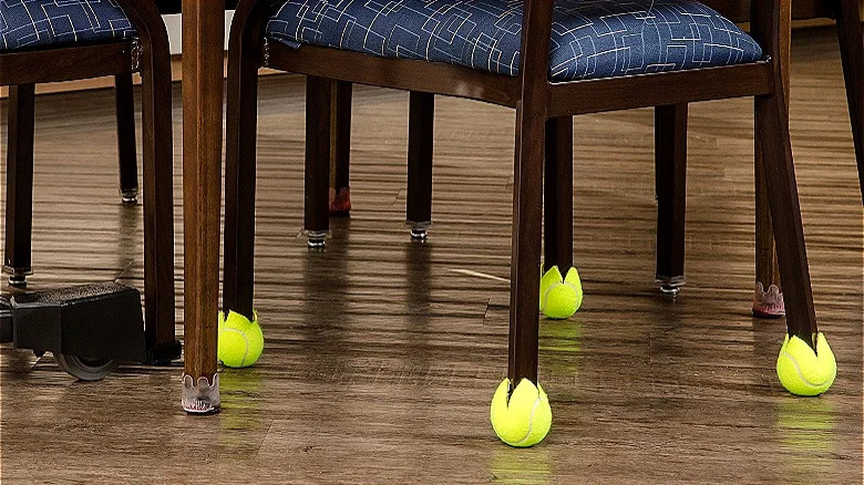 tennis balls on chair legs