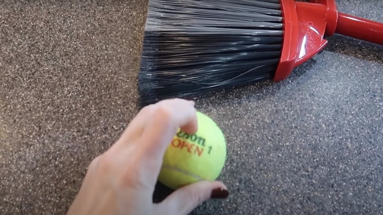 woman holding tennis ball