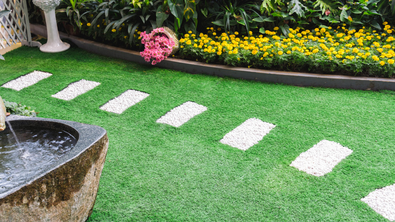 Hardscape areas marking a path across a lawn