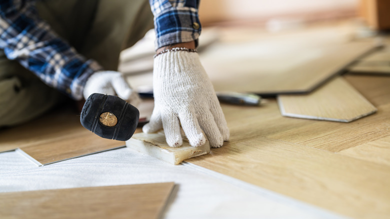 Man installing hardwood floor