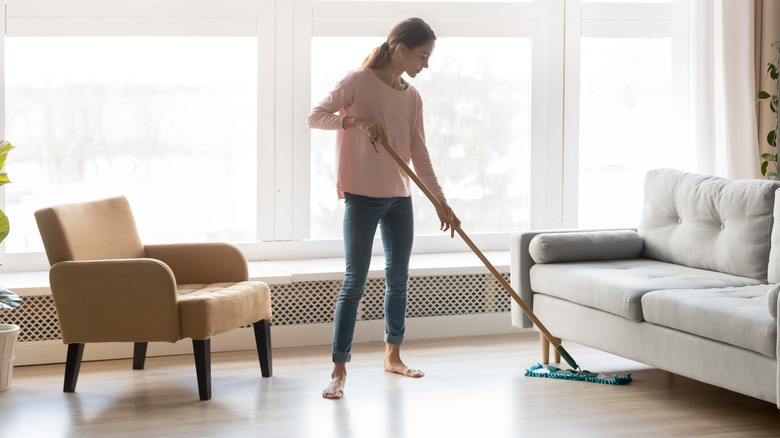 Woman cleaning hardwood floors