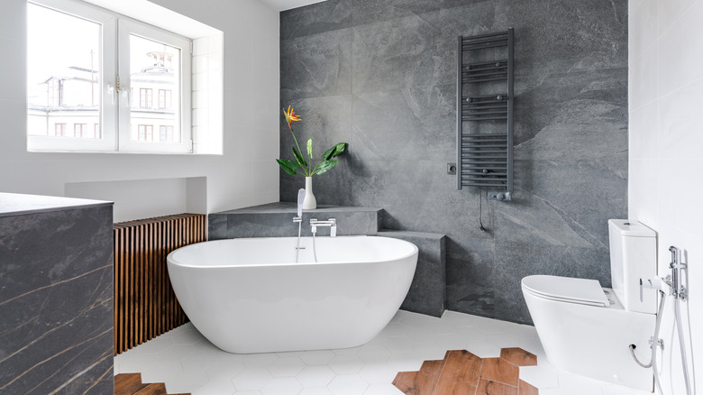 Small grey and white modern bathroom with window