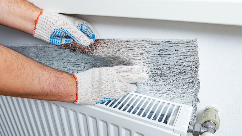 aluminum foil behind radiator