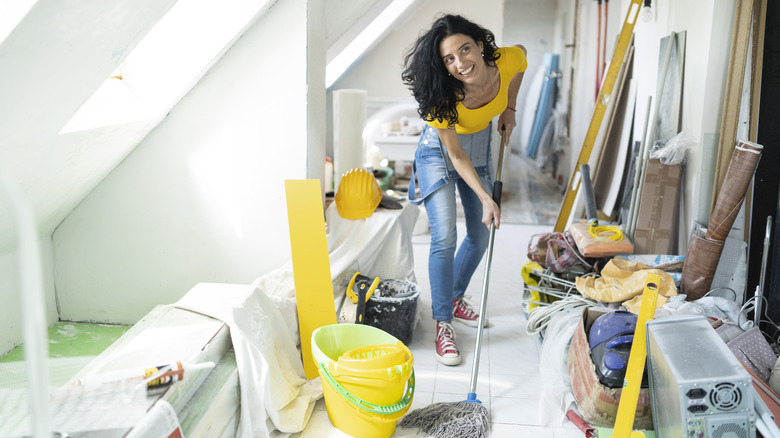 Person cleaning attic