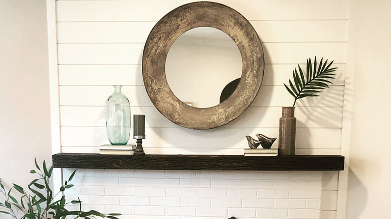 Mirror hung above the fireplace