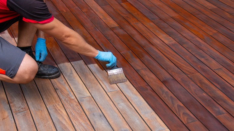 Man staining deck