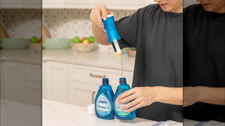 Woman refilling Dawn powerwash