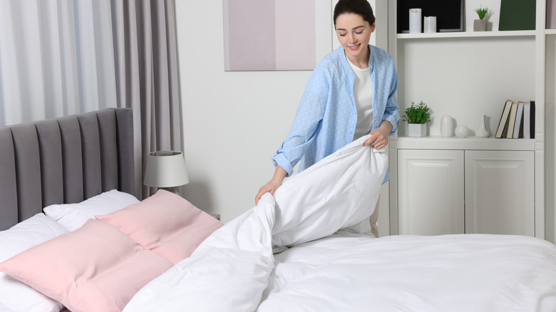 woman changing comforter