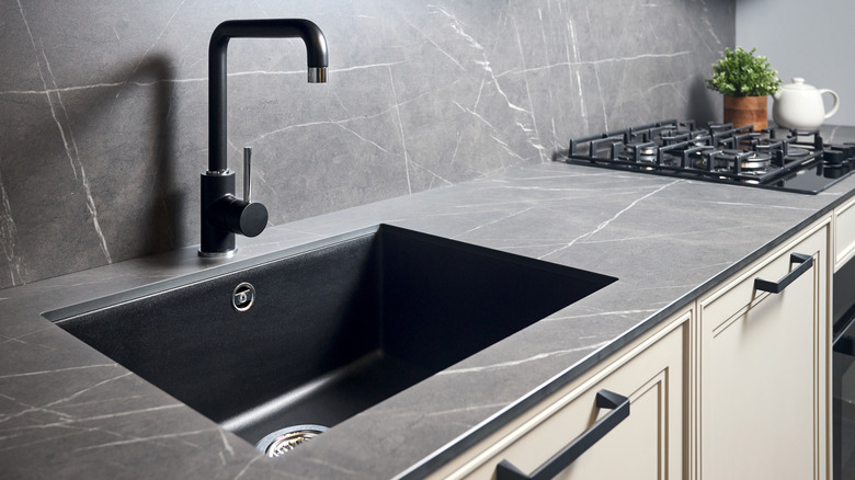 kitchen sink with black faucet