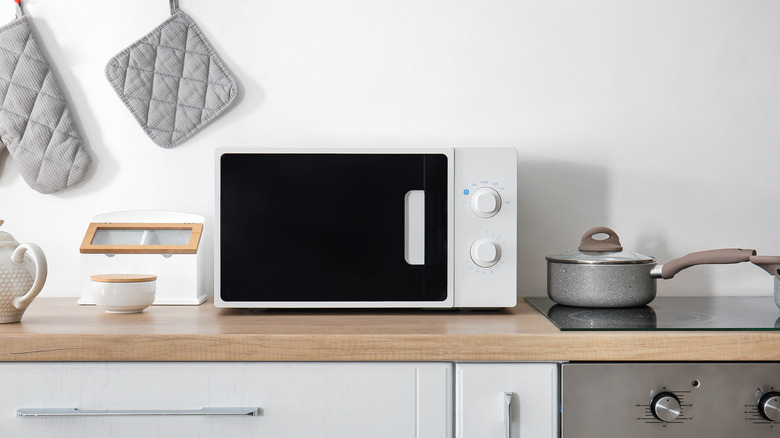 Simple white microwave in kitchen