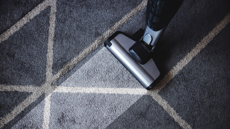 vacuum cleaning dirty carpet