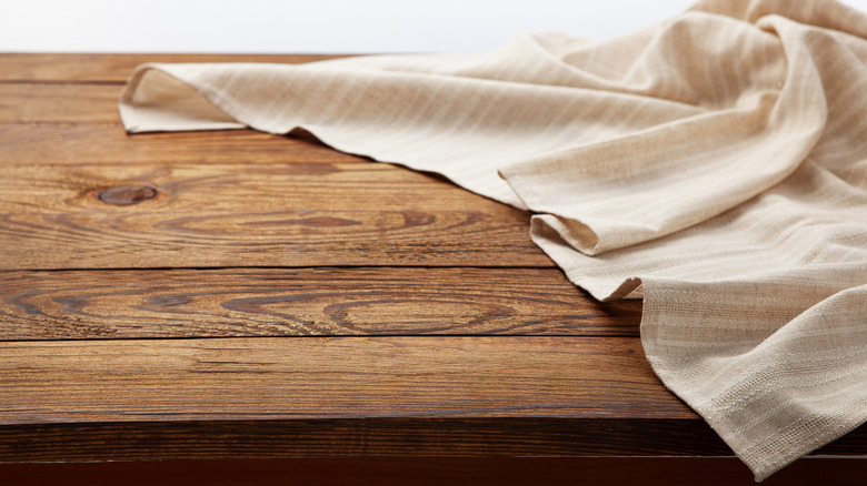 Striped tablecloth on wood table