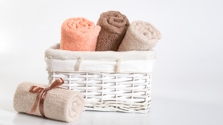 Rolled towels in a basket