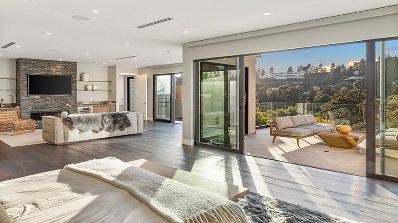 bedroom with open terrace and lounge area