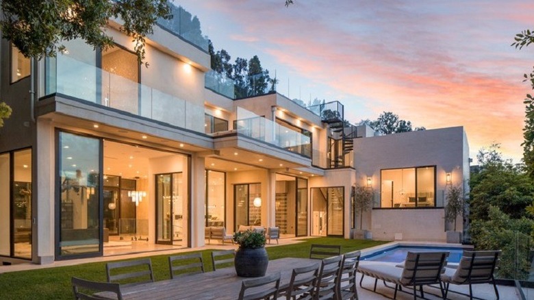 large outdoor area with pool and dining 