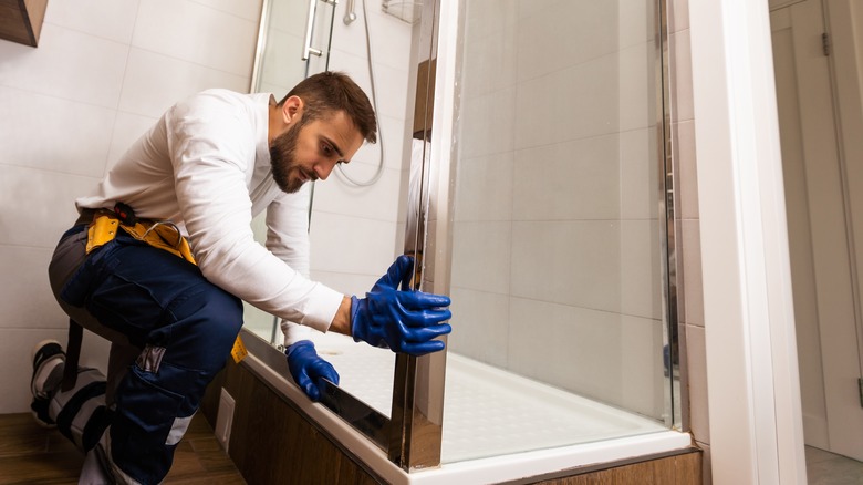 Plumber installing shower