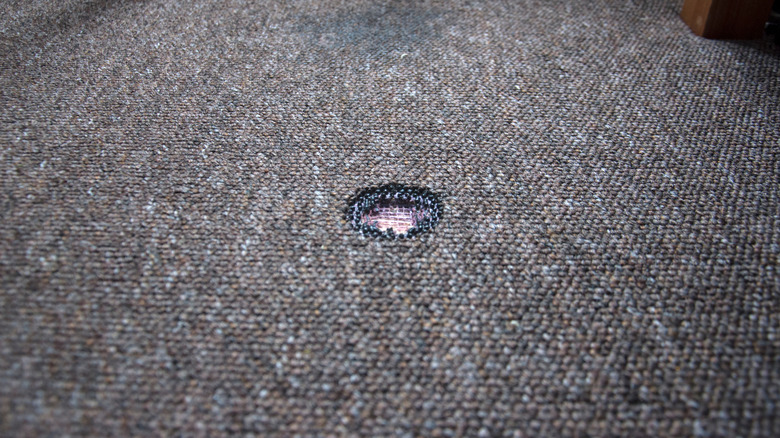 Burnt hole in carpet