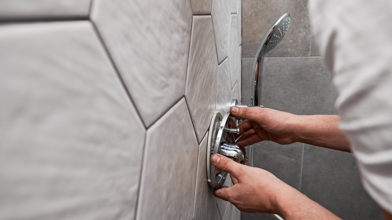 Person working on shower install