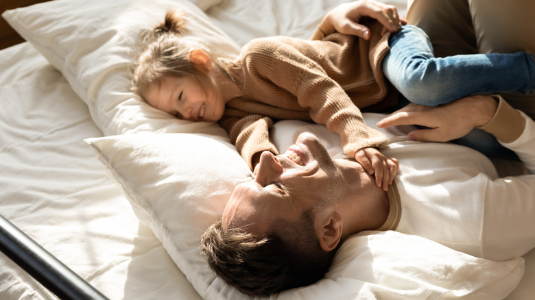 Man and child with pillows