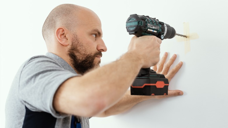 Person drilling with power drill