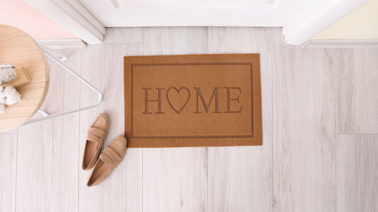 doormat with shoes in hallway